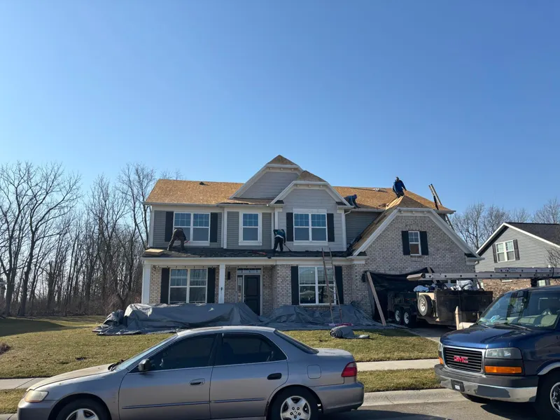 The Reasonable Roofers crew replacing the roof on a two-story home south of Indianapolis